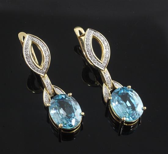 A pair of modern 18ct gold, blue zircon and diamond drop earrings, 36mm.